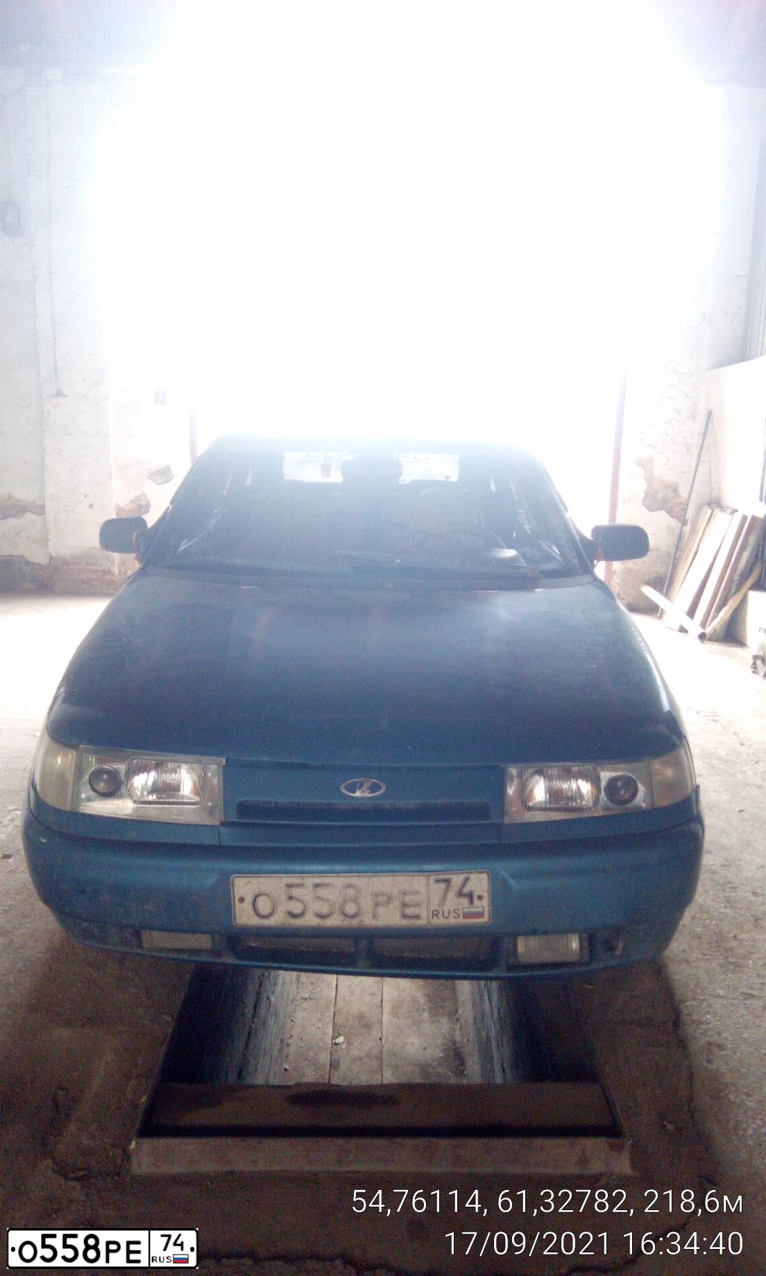 Фото автомобиля LADA 2112, 2001 — госномер О558РЕ74. Цвет: СИНЕ-ЗЕЛЕНЫЙ