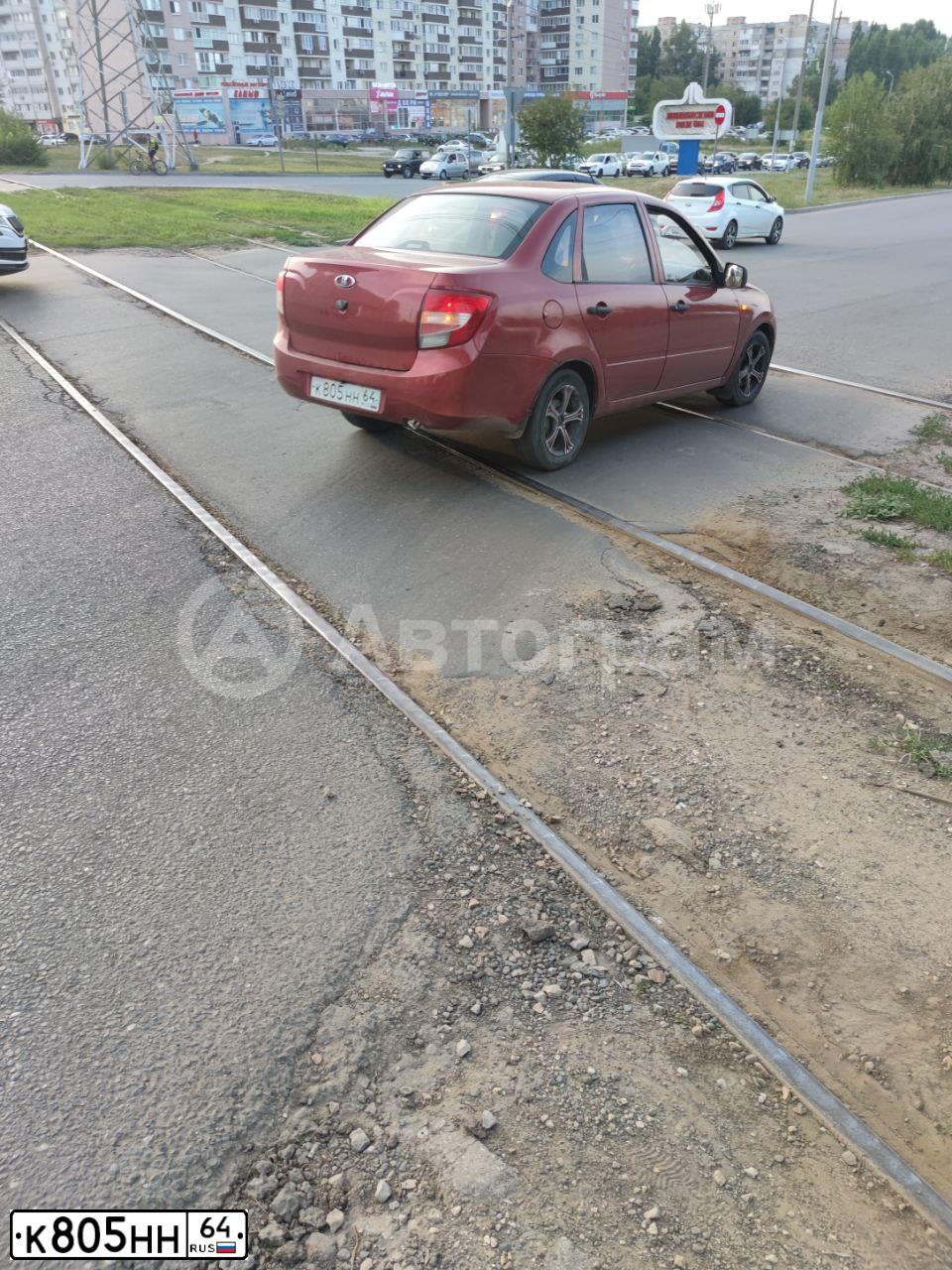 Фото автомобиля VAZ 2190 GRANTA, 2013 — госномер К805НН64. Цвет: СЕРЕБРИСТО КРАСНЫЙ