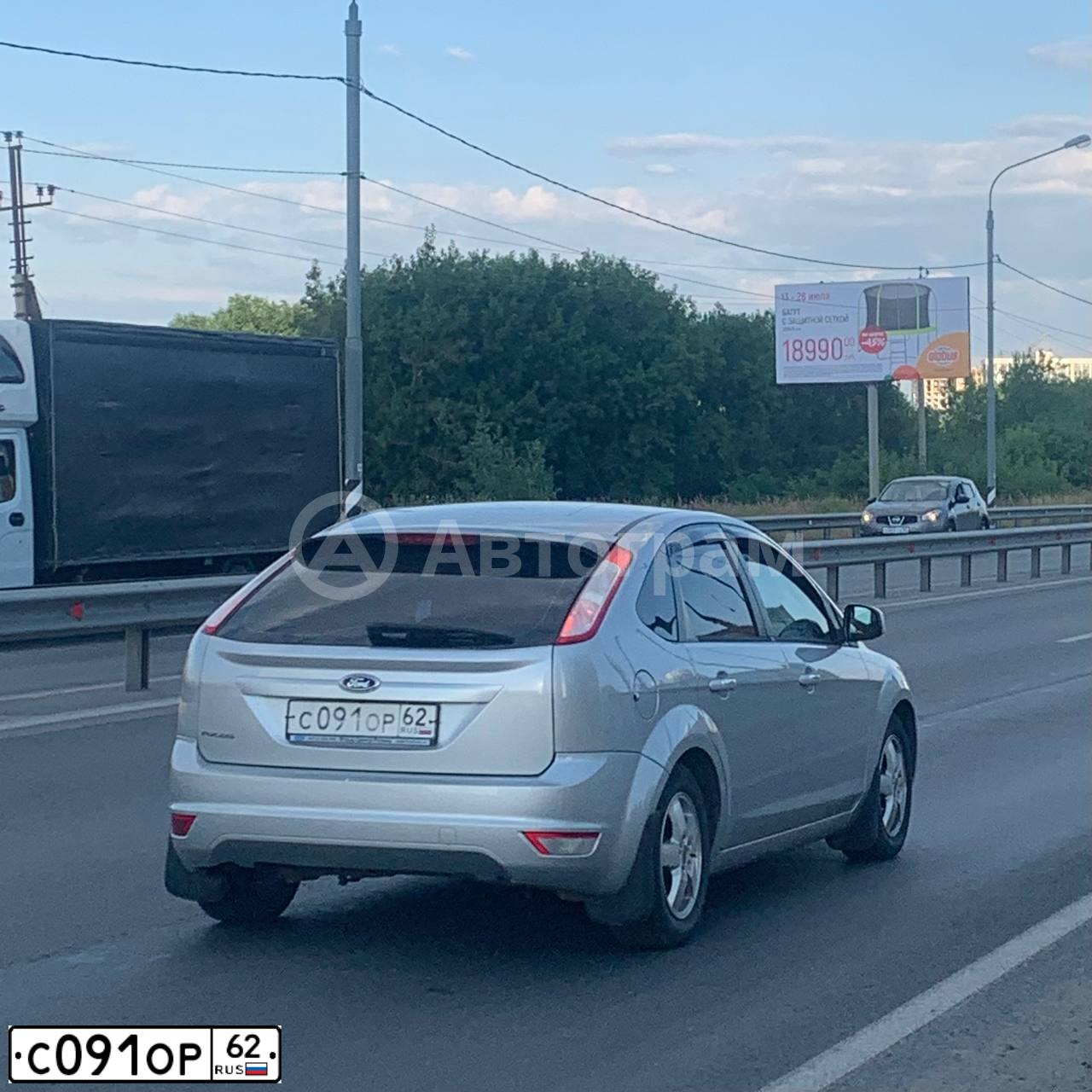Фото автомобиля FORD FOCUS, 2010 — госномер С091ОР62. Цвет: СЕРЕБРИСТЫЙ