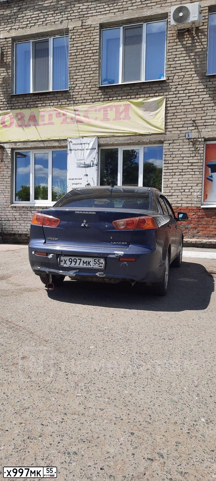Фото автомобиля MITSUBISHI LANCER, 2007 — госномер Х997МК55. Цвет: синий