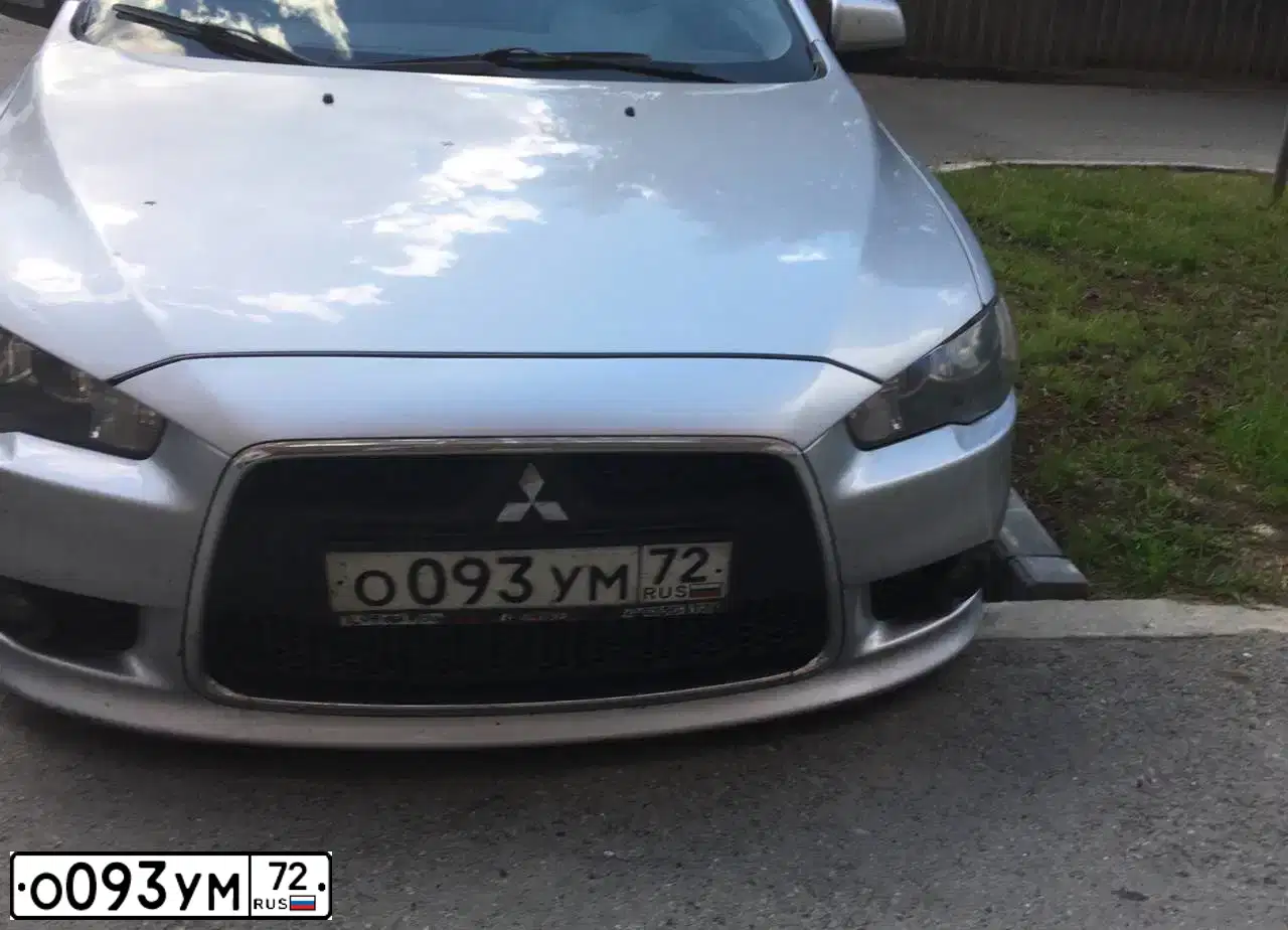 Фото автомобиля MITSUBISHI LANCER, 2011 — госномер О093УМ72. Цвет: СЕРЕБРИСТЫЙ