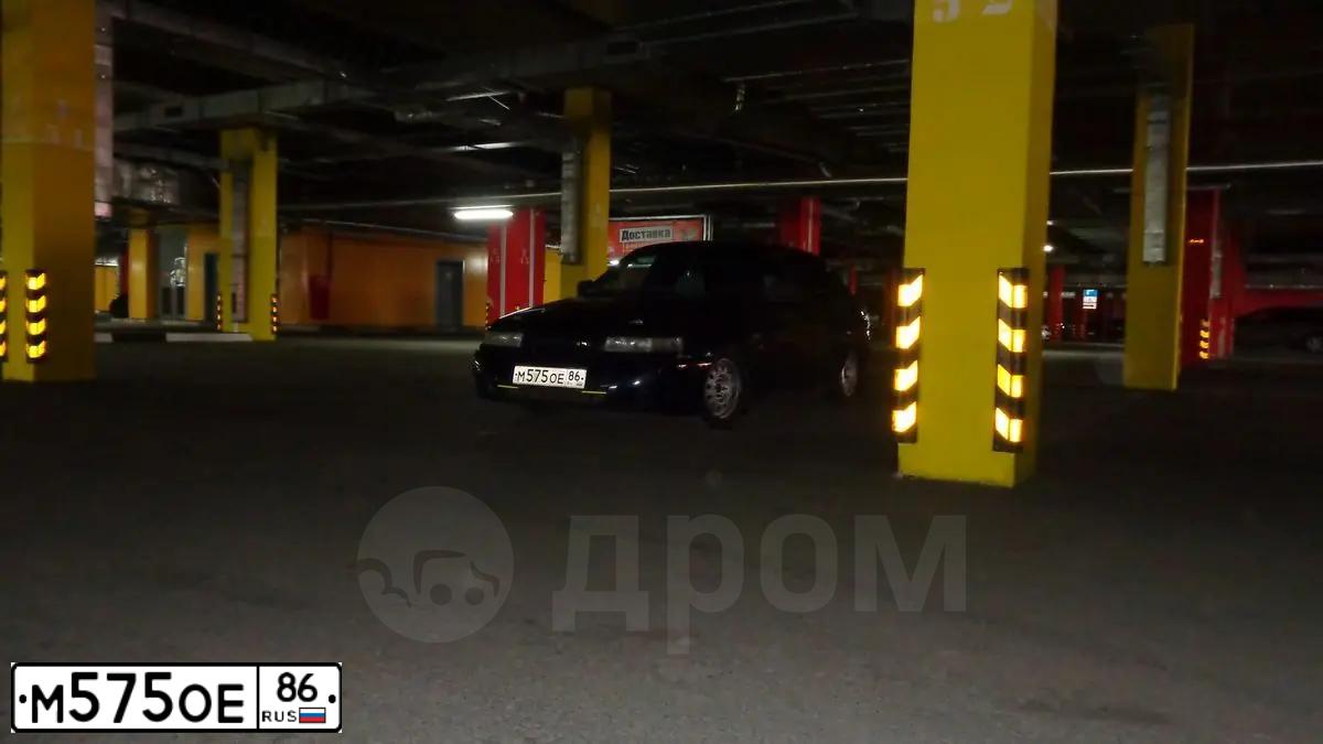 Фото автомобиля LADA 2110, 2005 — госномер Х040ХН72. Цвет: Серебристо-Желто-Голубой