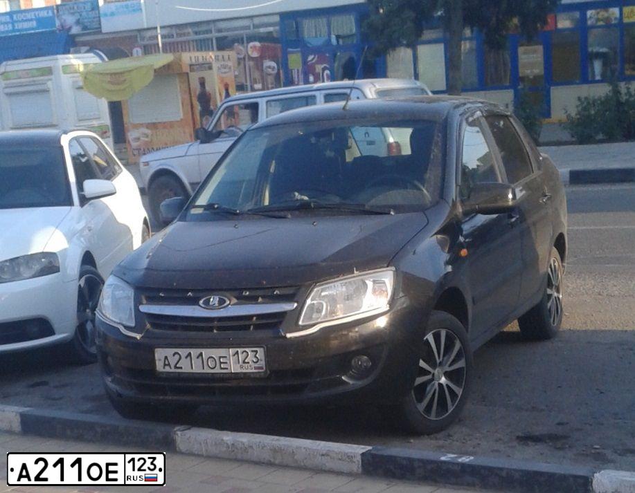 Фото автомобиля LADA 2190 GRANTA, 2014 — госномер А211ОЕ123. Цвет: ЧЕРНЫЙ