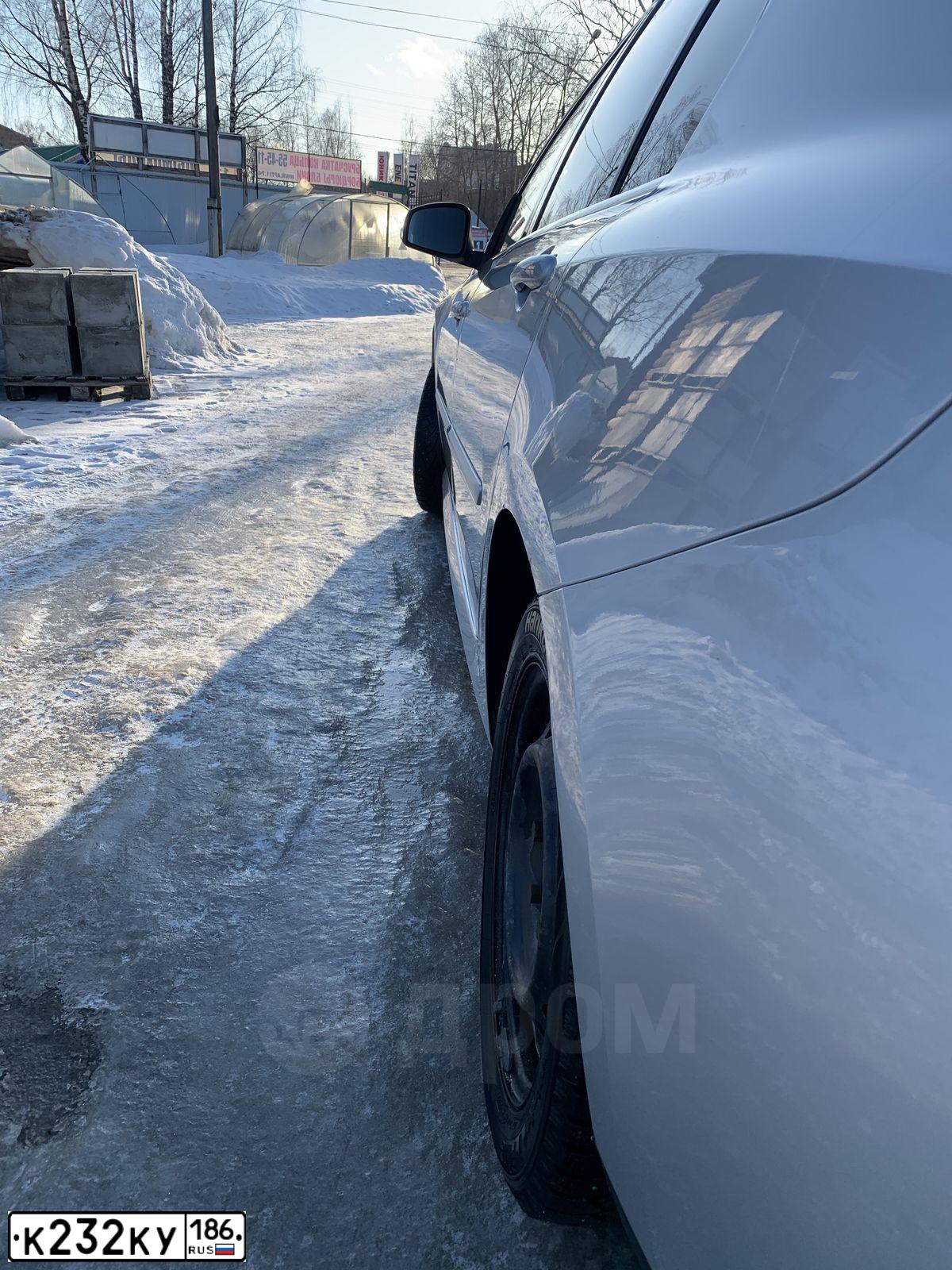 Фото автомобиля RENAULT LAGUNA, 2010 — госномер Р425СУ11. Цвет: Серебристый