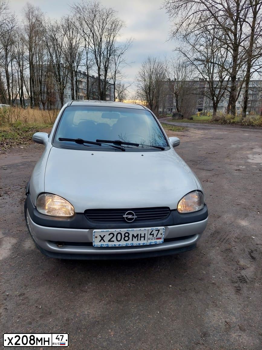 Фото автомобиля OPEL CORSA, 1999 — госномер М713ЕС198. Цвет: СЕРЫЙ