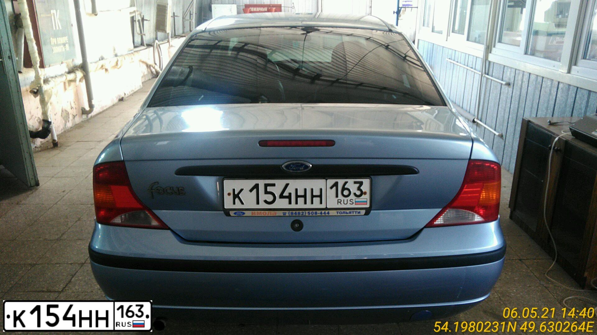 Фото автомобиля FORD FOCUS, 2003 — госномер Х064АУ977. Цвет: Светло-Серо-Голубой
