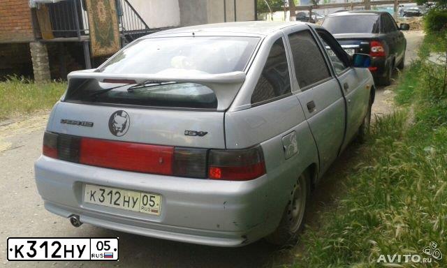 Фото автомобиля LADA 2112, 2004 — госномер К312НУ05. Цвет: СЕРЕБРИСТО-ЖЕЛТЫЙ