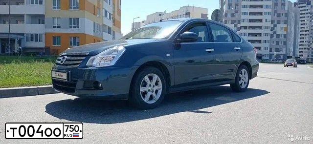 Фото автомобиля NISSAN ALMERA /AVTOVAZ/, 2018 — госномер Т004ОО750. Цвет: ТЕМНО-СИНИЙ