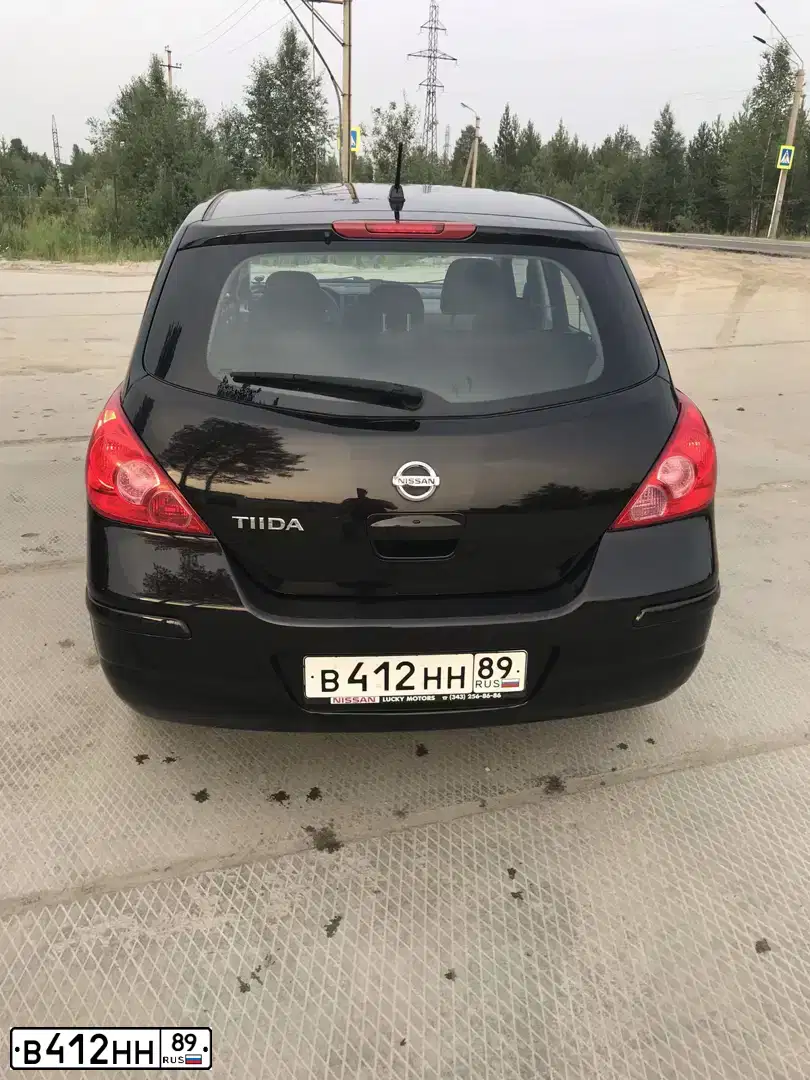 Фото автомобиля NISSAN TIIDA, 2011 — госномер А192МВ147. Цвет: Коричневый