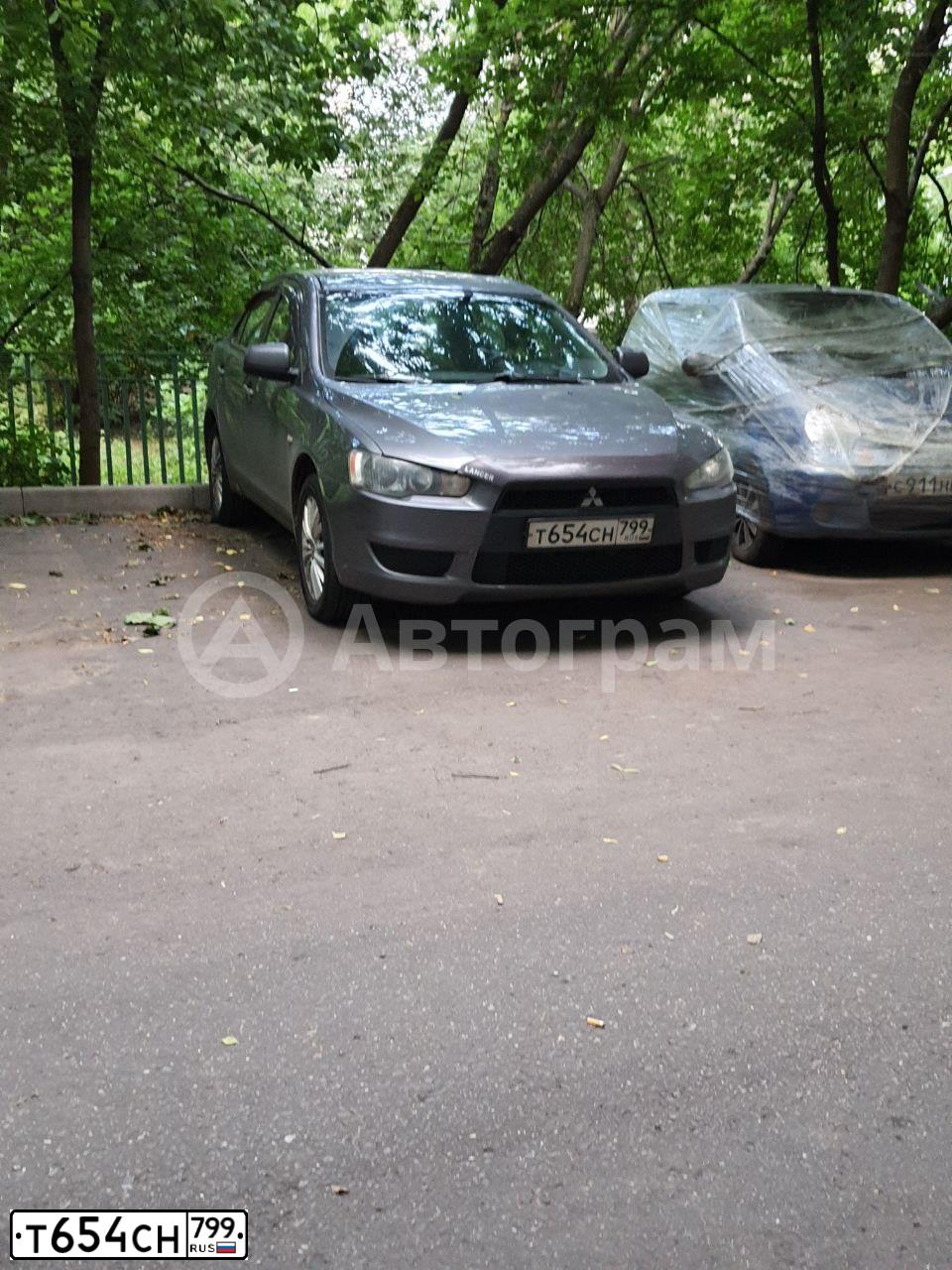 Фото автомобиля MITSUBISHI LANCER, 2008 — госномер Т645СН799. Цвет: СЕРЫЙ
