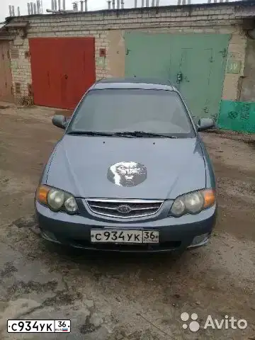 Фото автомобиля KIA SEPHIA, 2001 — госномер С934УК36. Цвет: Серо-Синий