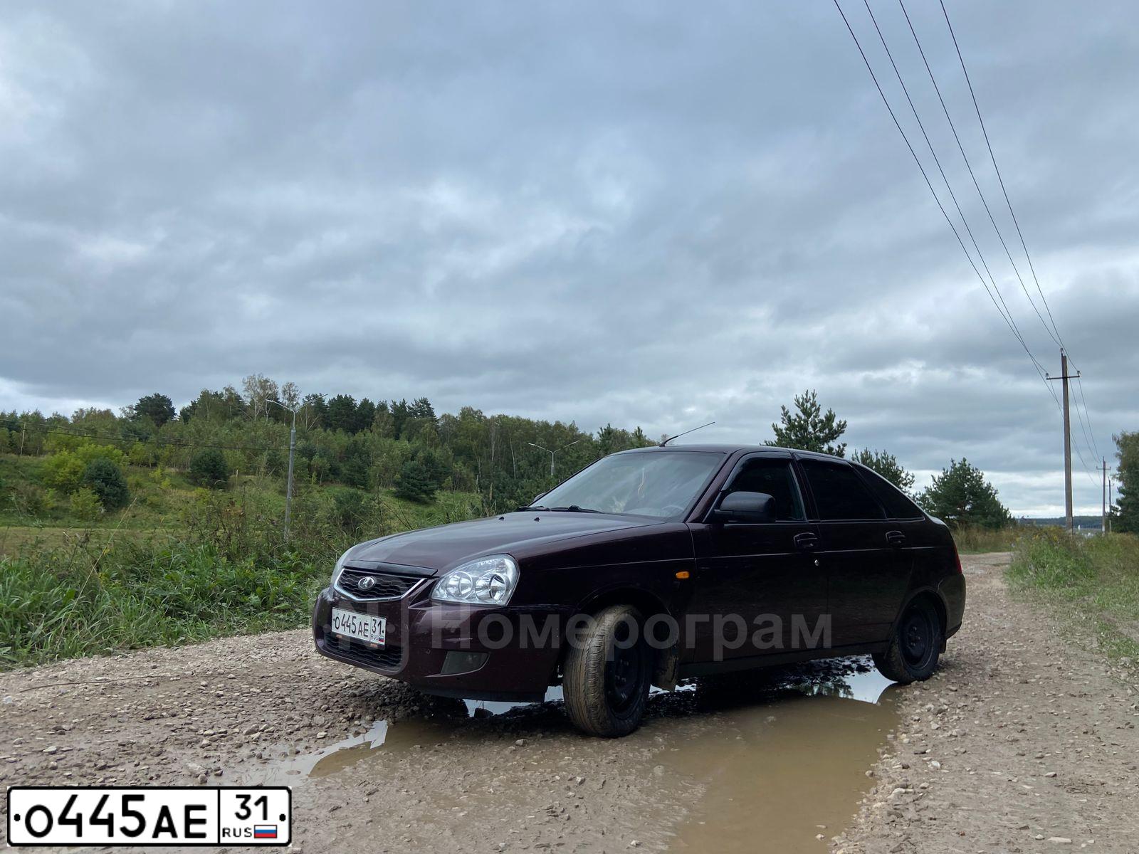Фото автомобиля LADA 2172 PRIORA, 2012 — госномер О445АЕ31. Цвет: ТЕМНО-ВИШНЕВЫЙ