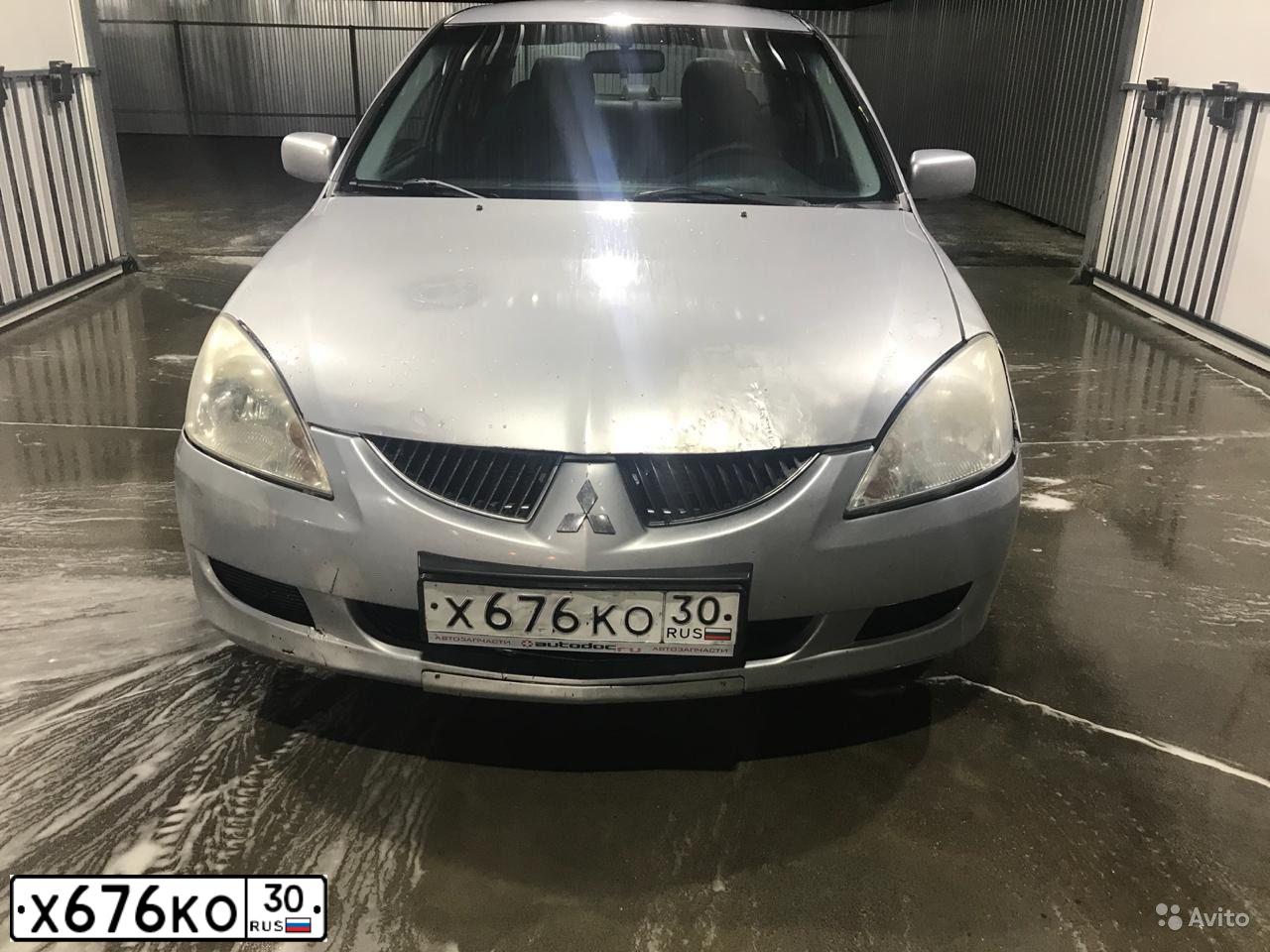 Фото автомобиля MITSUBISHI LANCER, 2005 — госномер Х676КО30. Цвет: СЕРЕБРИСТЫЙ