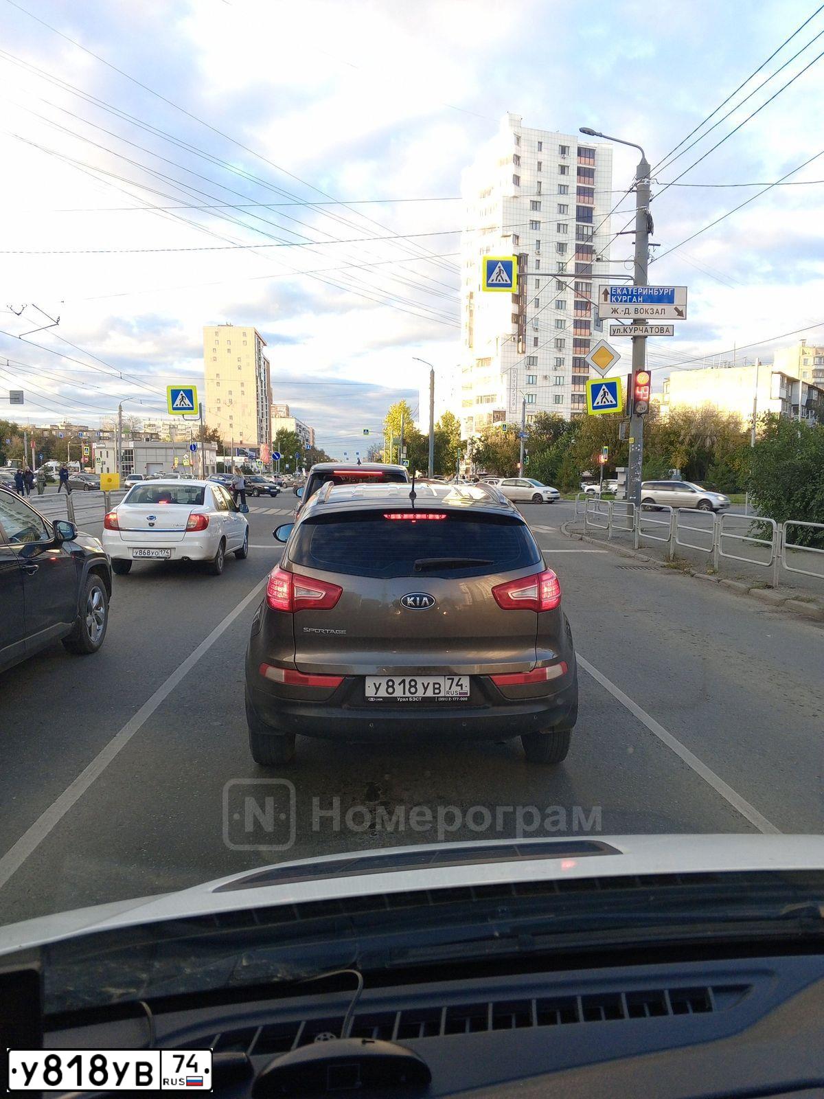 Фото автомобиля KIA SPORTAGE, 2012 — госномер О008АО05. Цвет: Коричневый