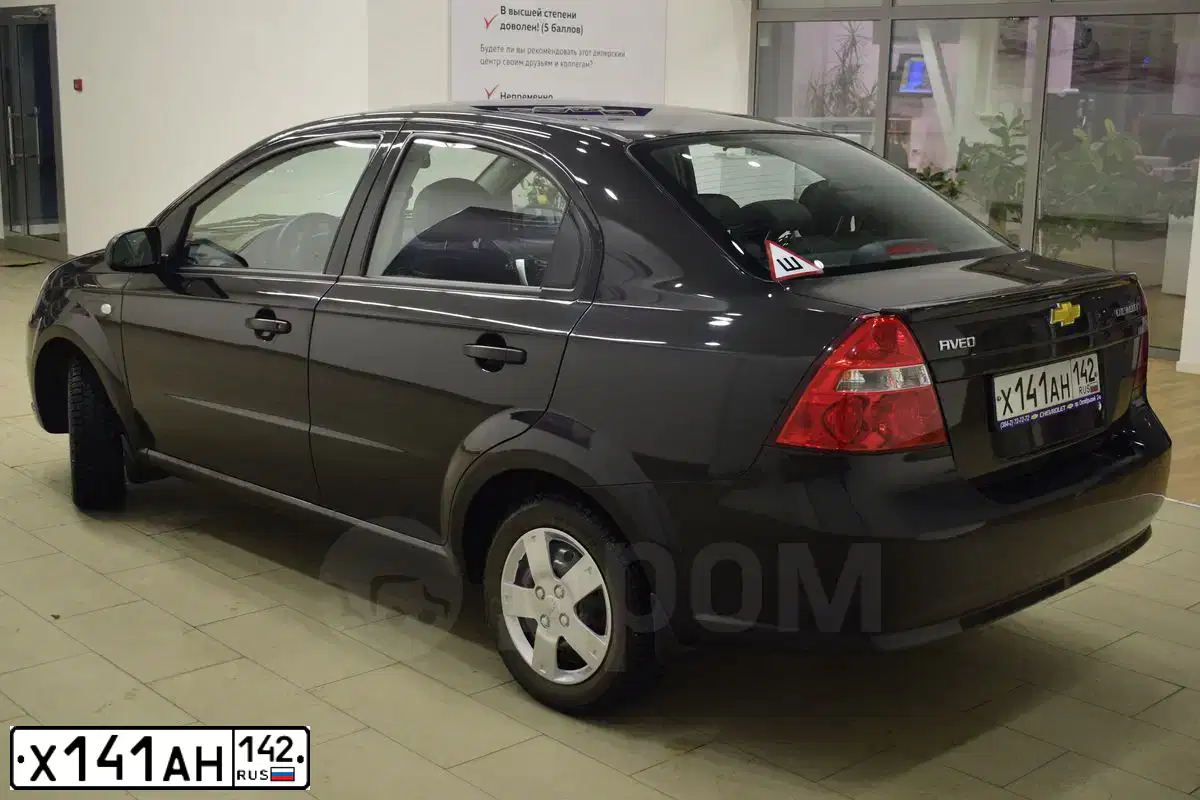 Фото автомобиля CHEVROLET AVEO, 2011 — госномер Х141АН142. Цвет: ЧЕРНЫЙ