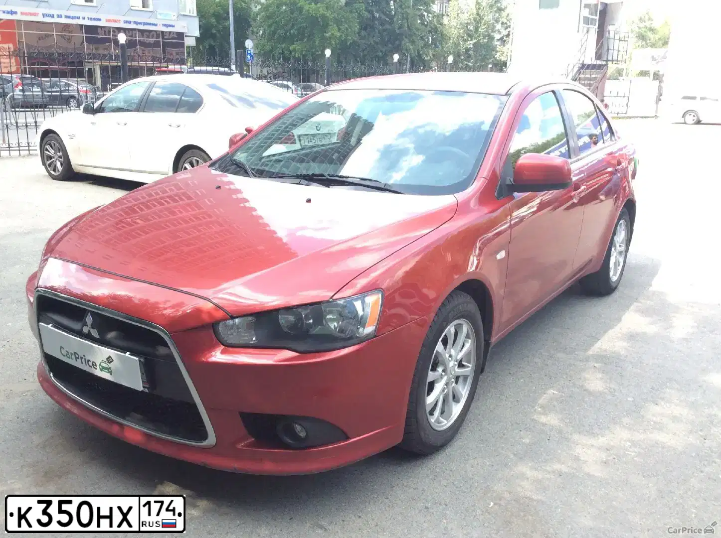 Фото автомобиля MITSUBISHI LANCER, 2011 — госномер С959ТМ174. Цвет: Красный