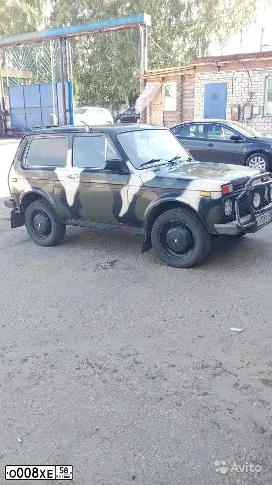 Фото автомобиля LADA 2121 NIVA, 1994 — госномер О008ХЕ58. Цвет: Хаки