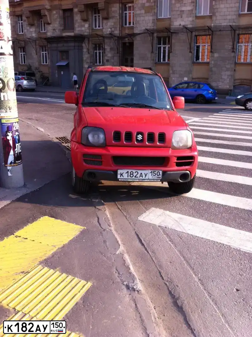 Фото автомобиля SUZUKI JIMNY, 2006 — госномер К182АУ150. Цвет: КРАСНЫЙ