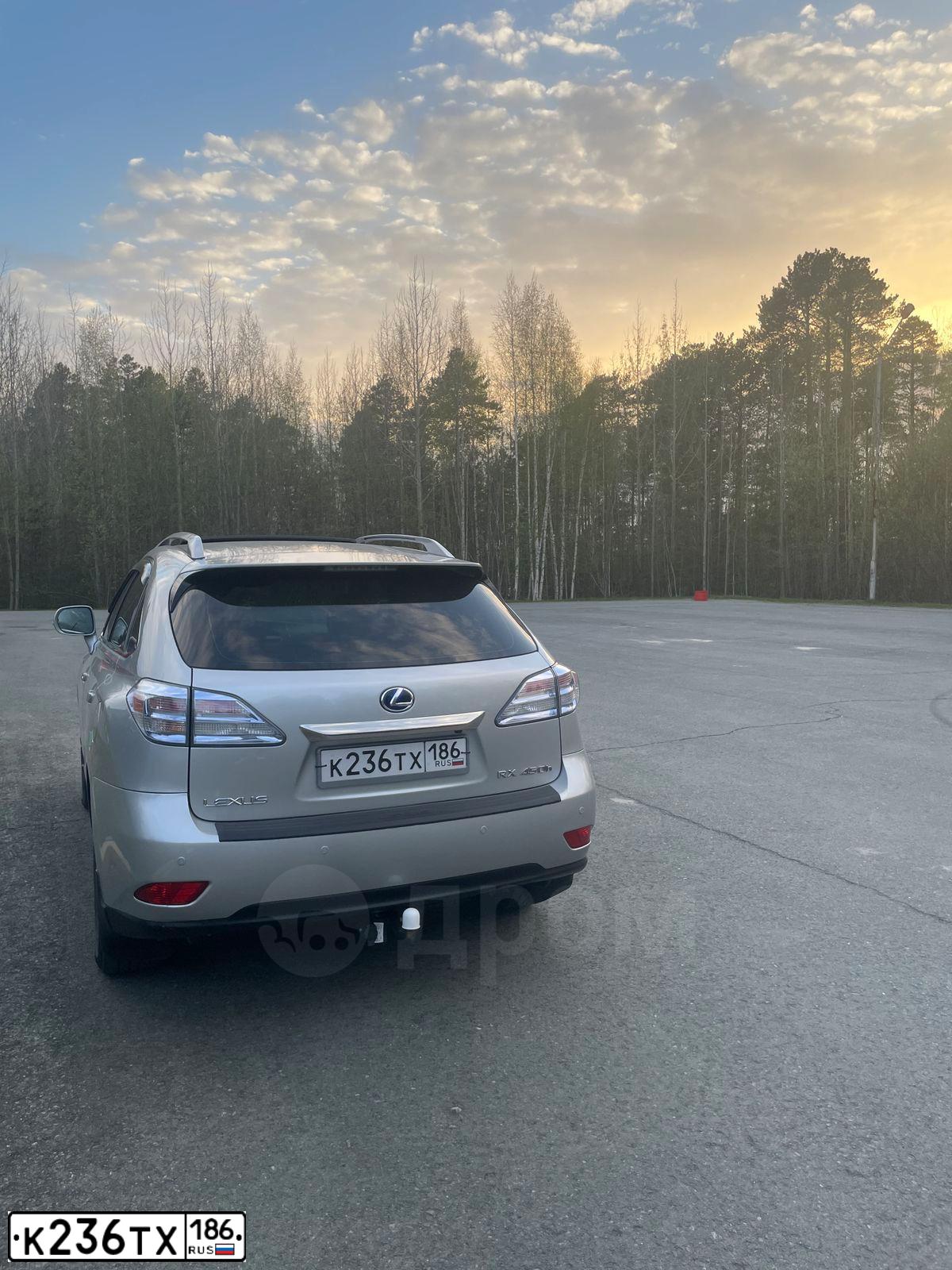 Фото автомобиля LEXUS RX, 2011 — госномер М002ОМ186. Цвет: Серебристый