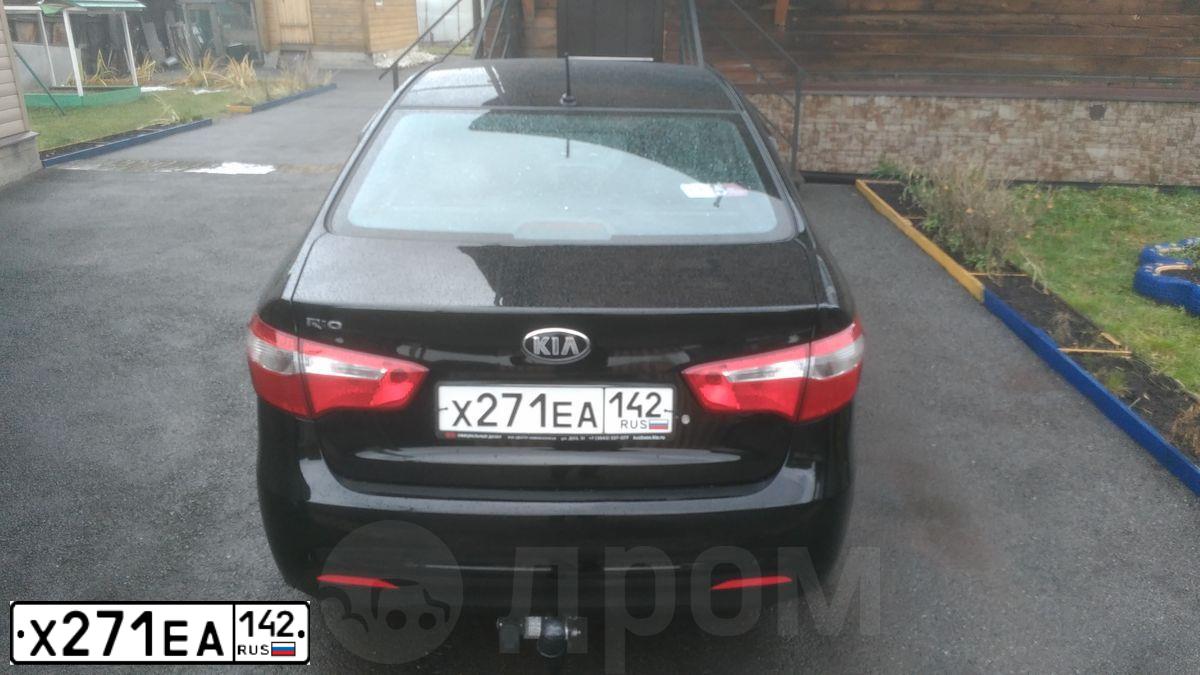 Фото автомобиля KIA RIO, 2014 — госномер Х271ЕА142. Цвет: ЧЕРНЫЙ