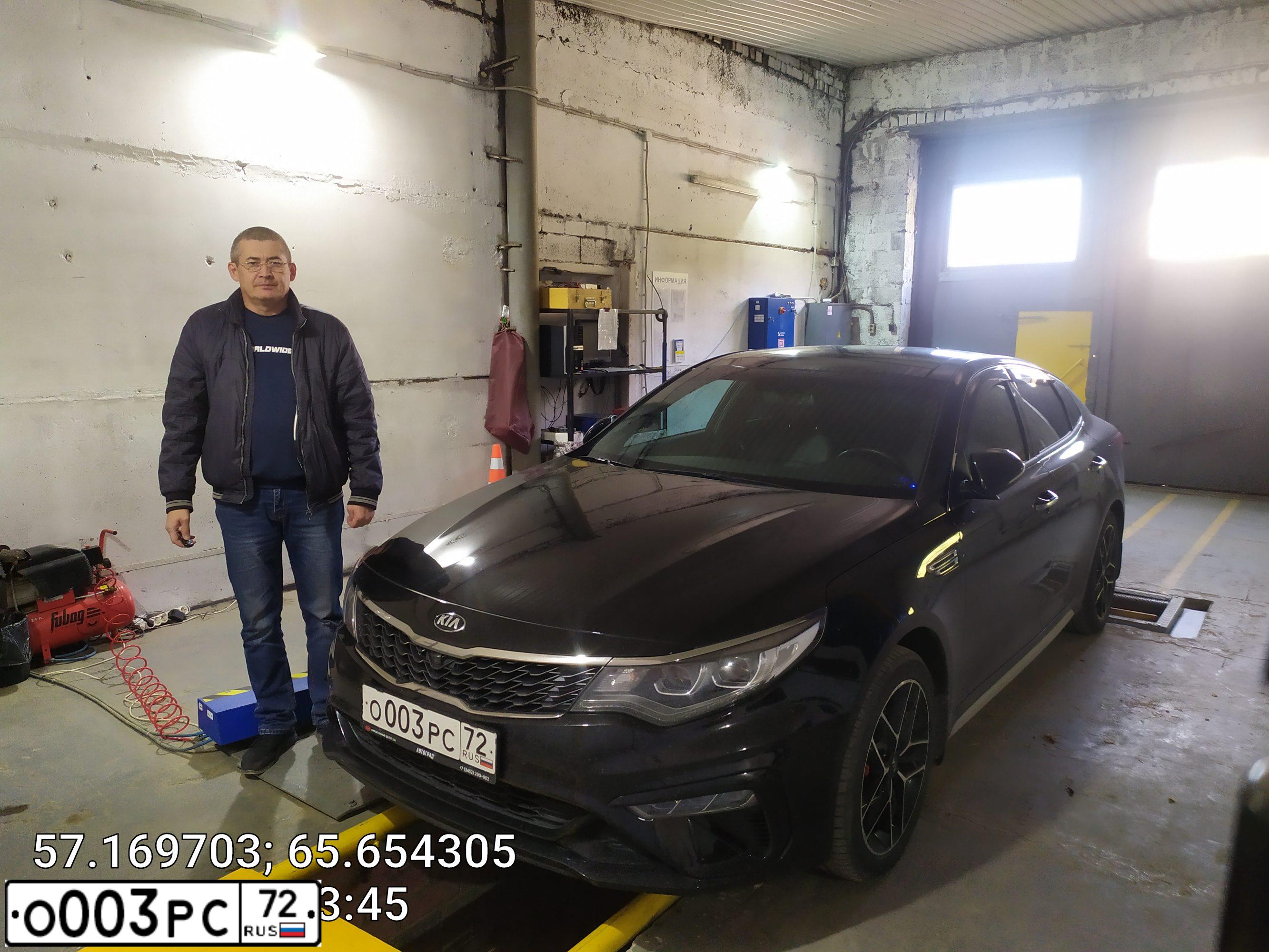 Фото автомобиля BMW X1, 2012 — госномер О003РС72. Цвет: Коричневый