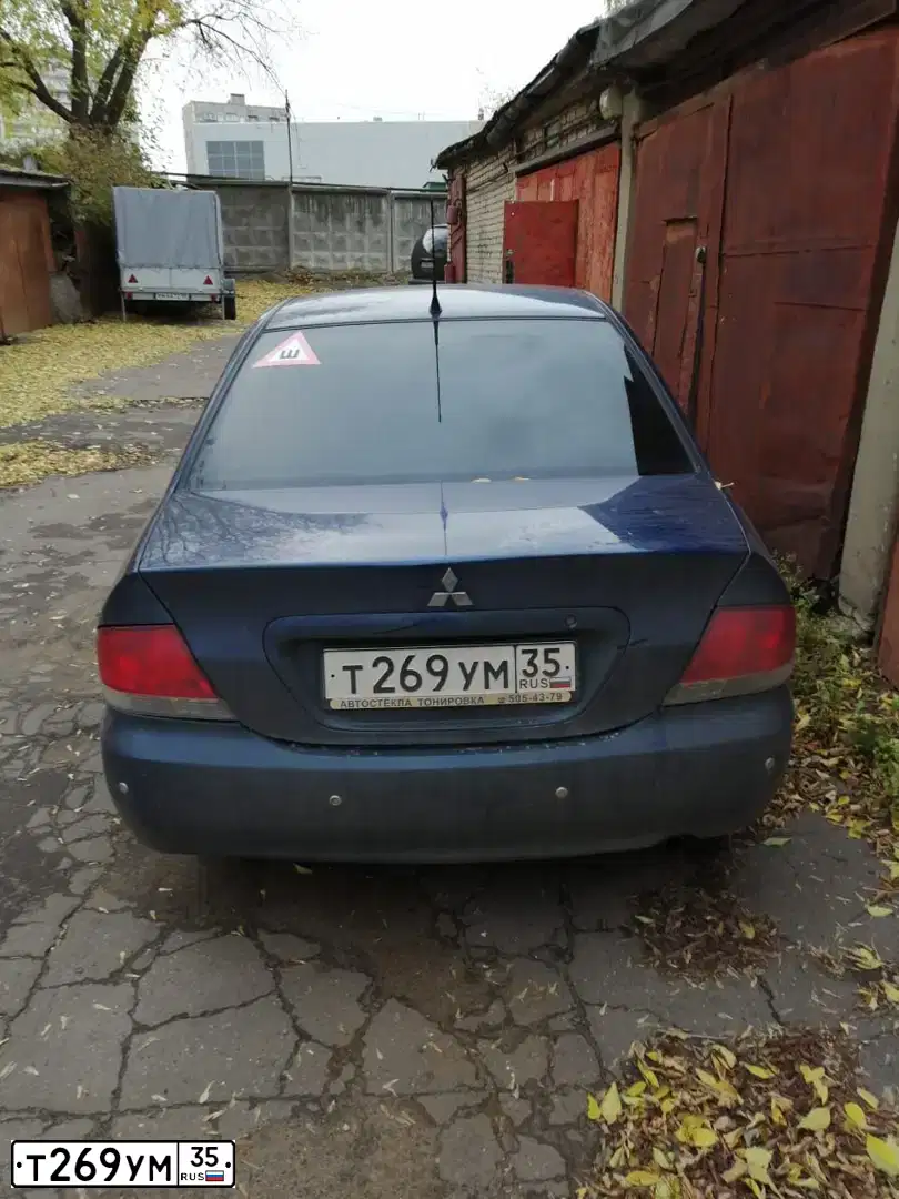 Фото автомобиля MITSUBISHI LANCER, 2004 — госномер Т269УМ35. Цвет: синий