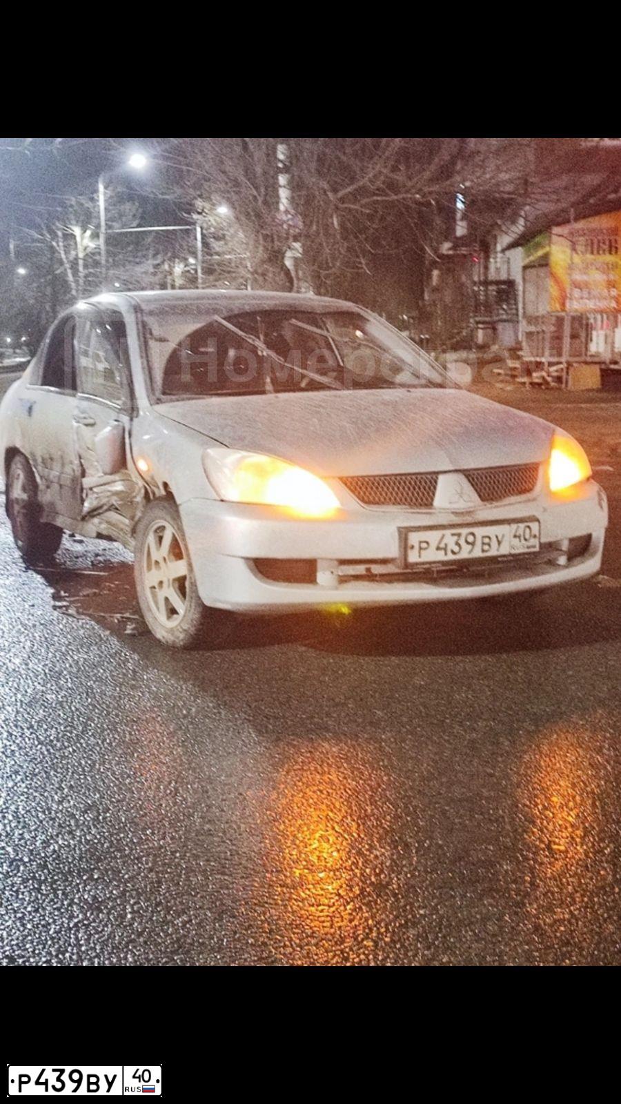 Фото автомобиля MITSUBISHI LANCER, 2007 — госномер О570НЕ32. Цвет: Серебристый