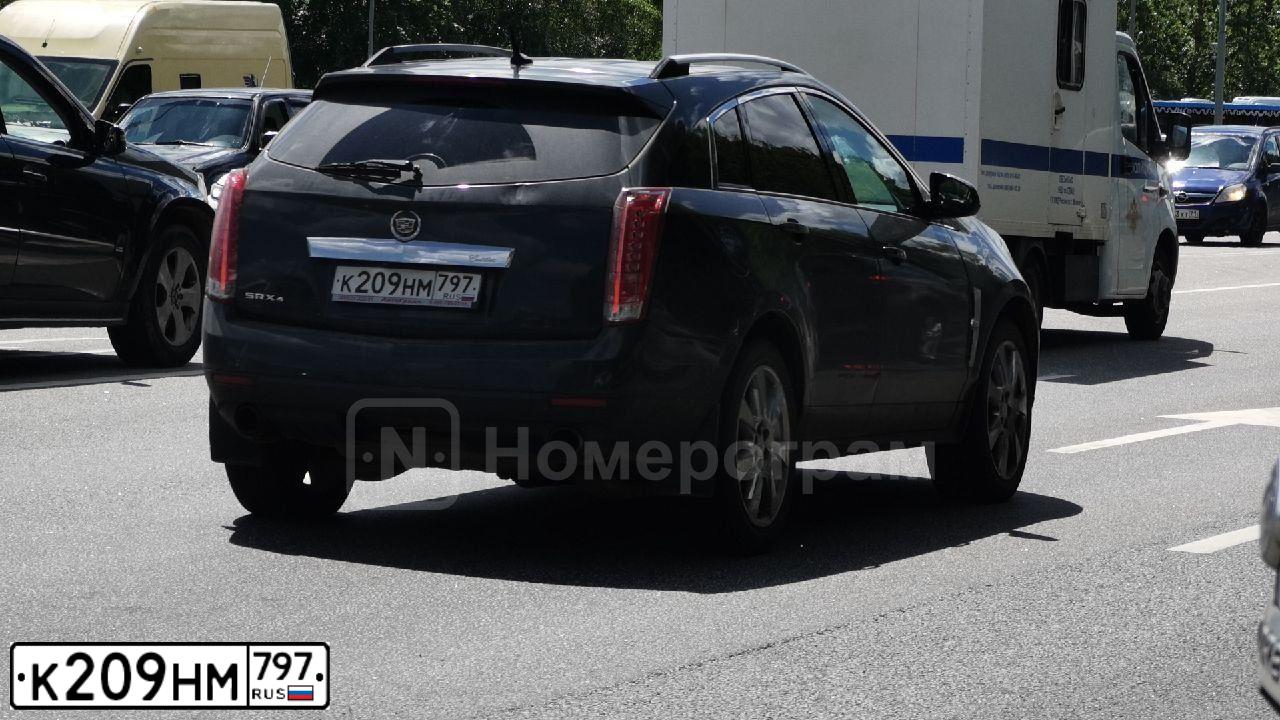Фото автомобиля CADILLAC SRX, 2011 — госномер К209НМ797. Цвет: ЧЕРНЫЙ МЕТАЛЛИК
