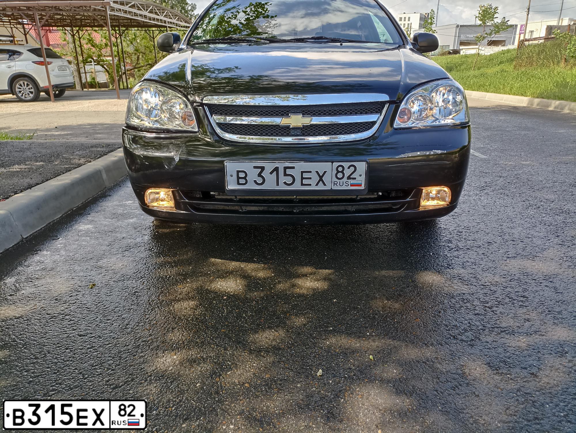 Фото автомобиля CHEVROLET LACETTI, 2005 — госномер Е216ХХ150. Цвет: ЧЕРНЫЙ