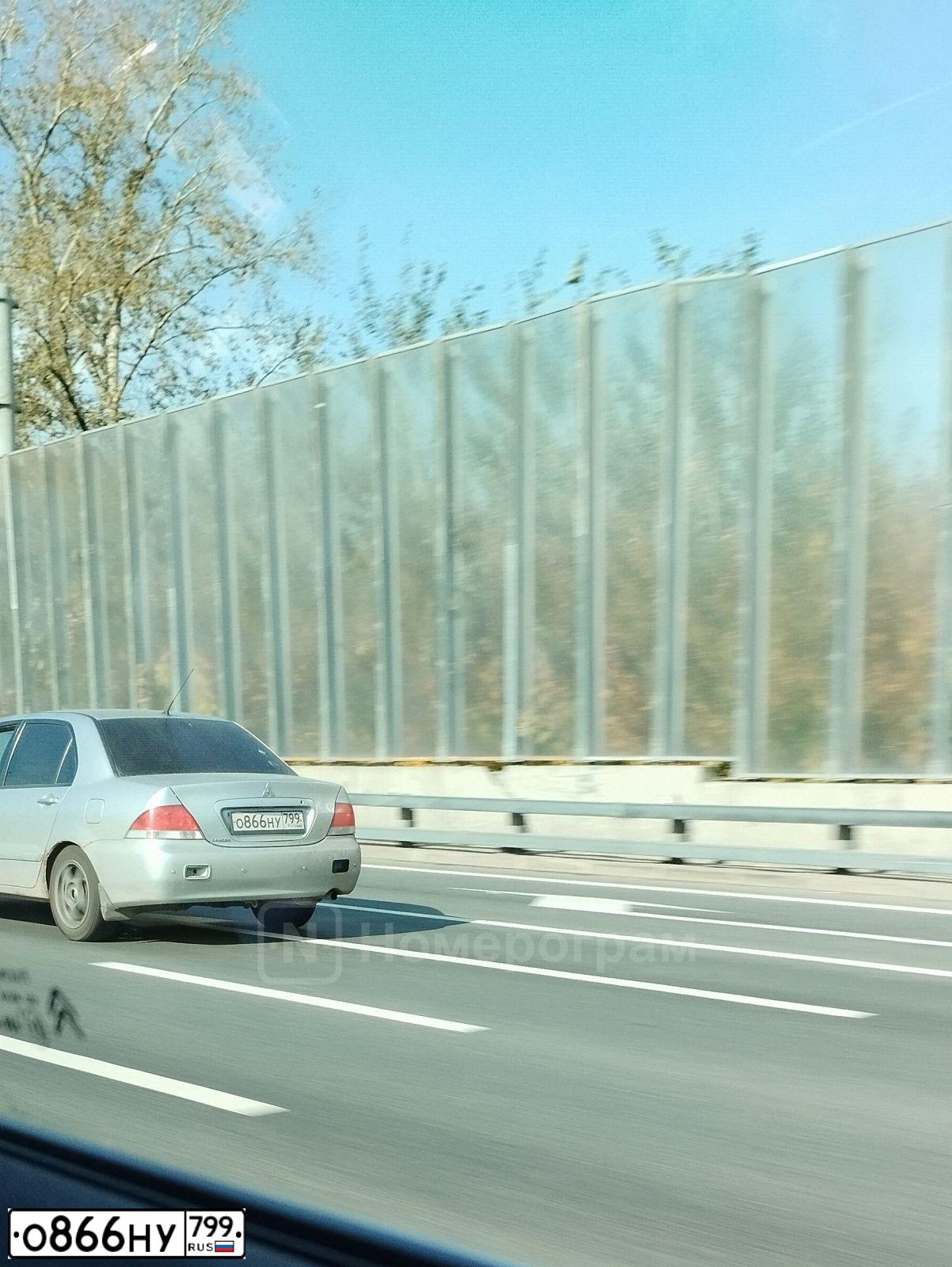 Фото автомобиля MITSUBISHI LANCER, 2006 — госномер Т128РЕ154. Цвет: СЕРЕБРИСТЫЙ