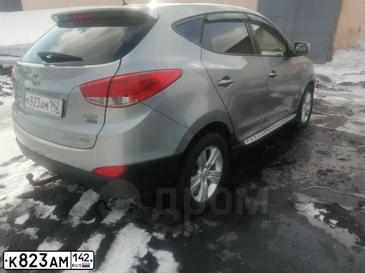 Фото автомобиля HYUNDAI TUCSON, 2011 — госномер К823АМ142. Цвет: СЕРЫЙ