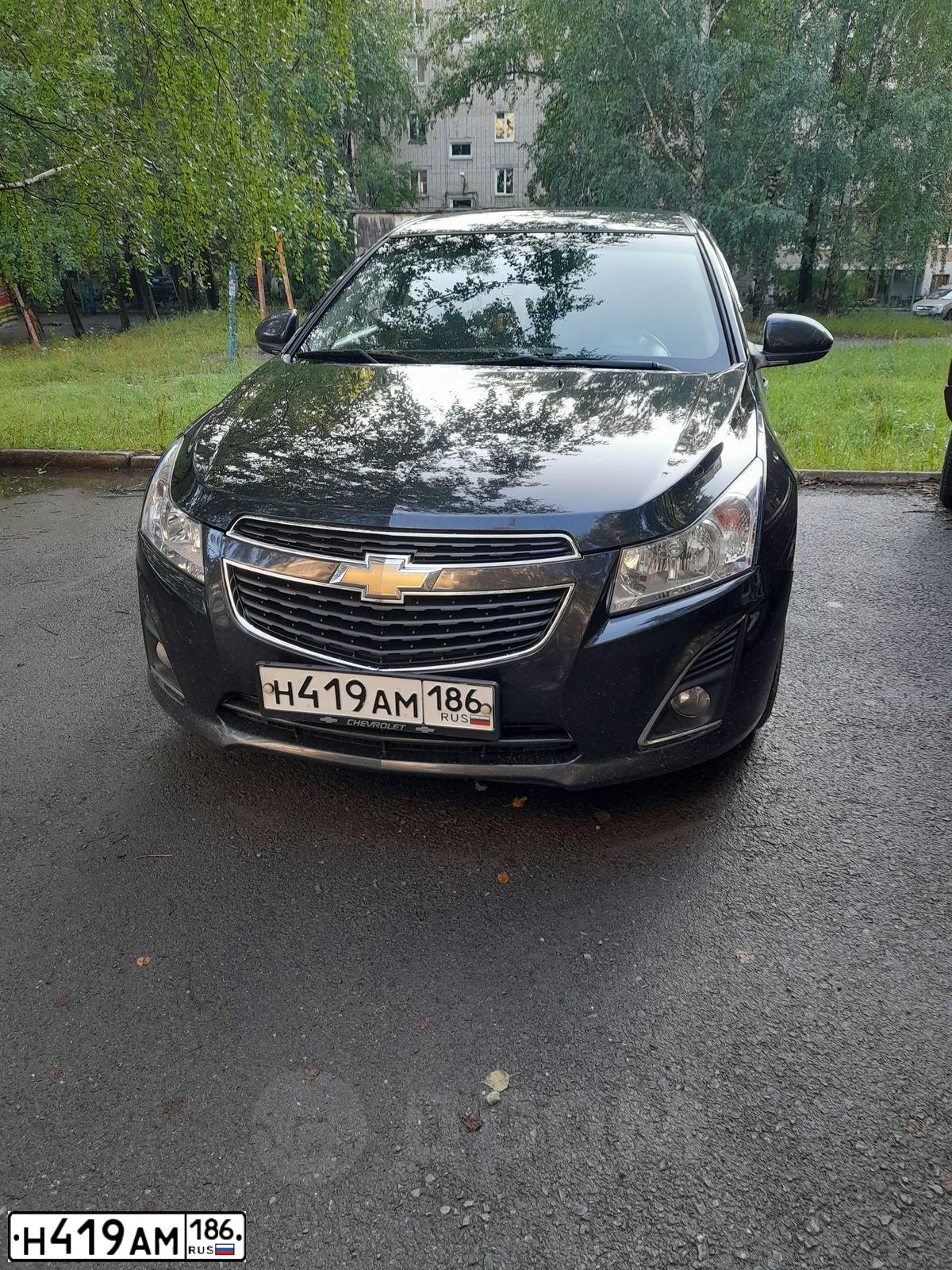 Фото автомобиля CHEVROLET CRUZE, 2013 — госномер К712КМ774. Цвет: ЧЕРНЫЙ МЕТАЛЛИК