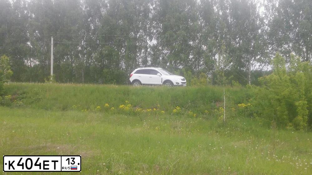 Фото автомобиля OPEL ANTARA, 2013 — госномер К404ЕТ13. Цвет: Белый
