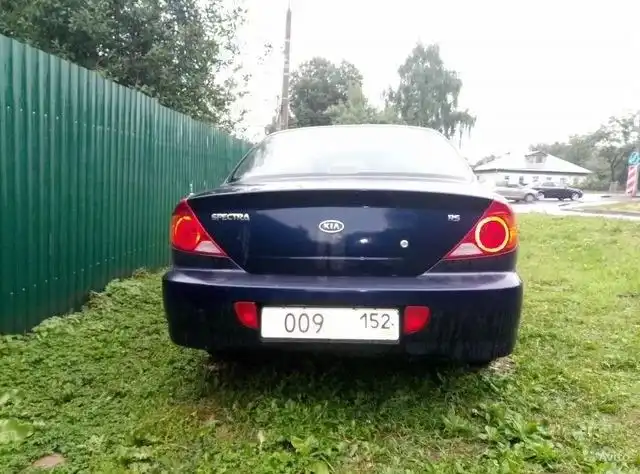 Фото автомобиля KIA SPECTRA, 2009 — госномер К346РМ21. Цвет: Темно-синий