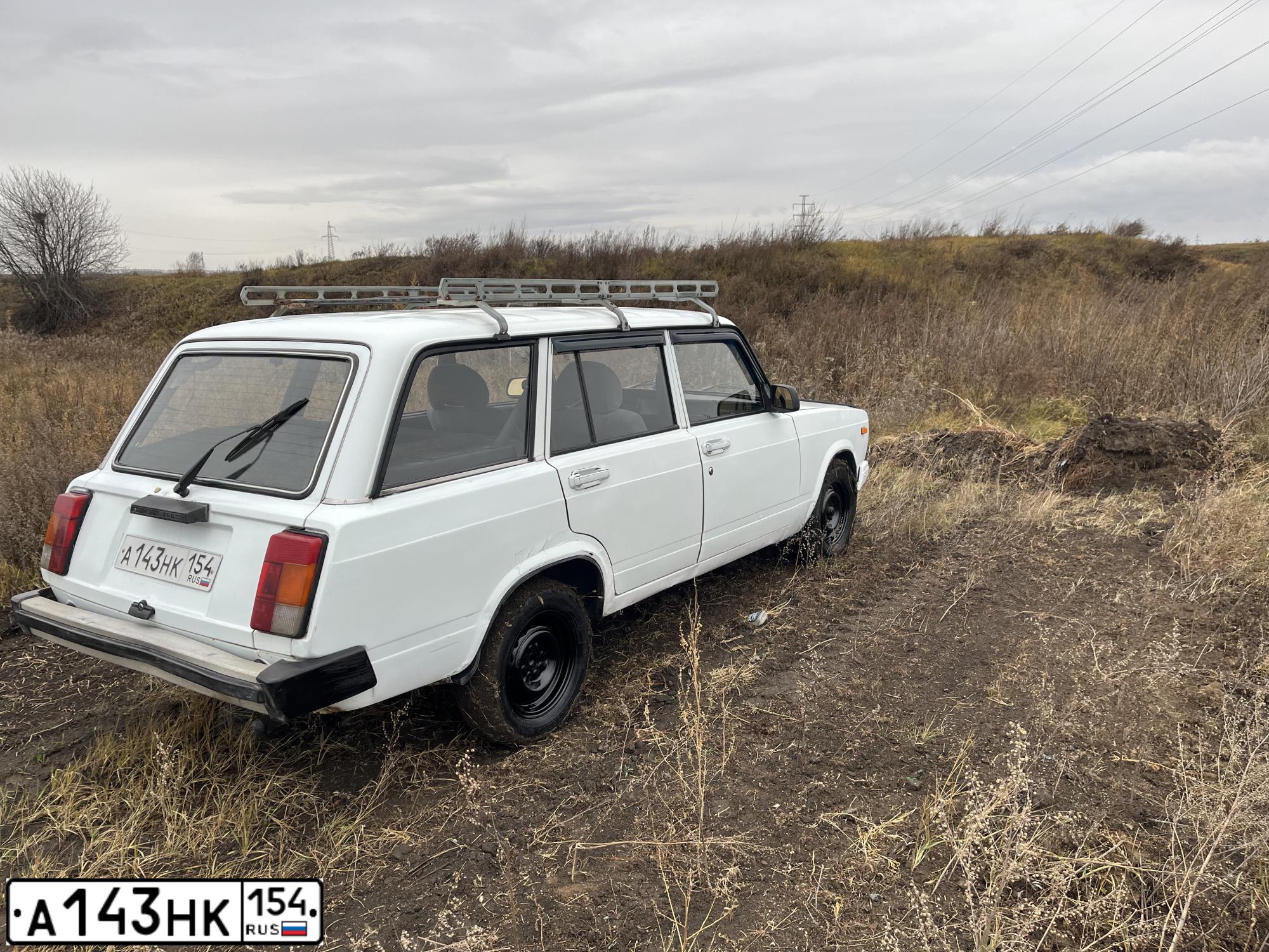 Фото автомобиля LADA 2104, 2007 — госномер А143НК154. Цвет: БЕЛЫЙ