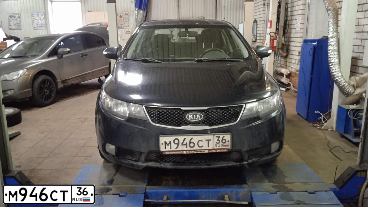 Фото автомобиля KIA CERATO, 2010 — госномер М946СТ36. Цвет: ЧЕРНЫЙ