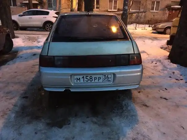 Фото автомобиля LADA 2112, 2002 — госномер С618НМ136. Цвет: СЕРЕБРИСТО-ЖЕЛТЫЙ