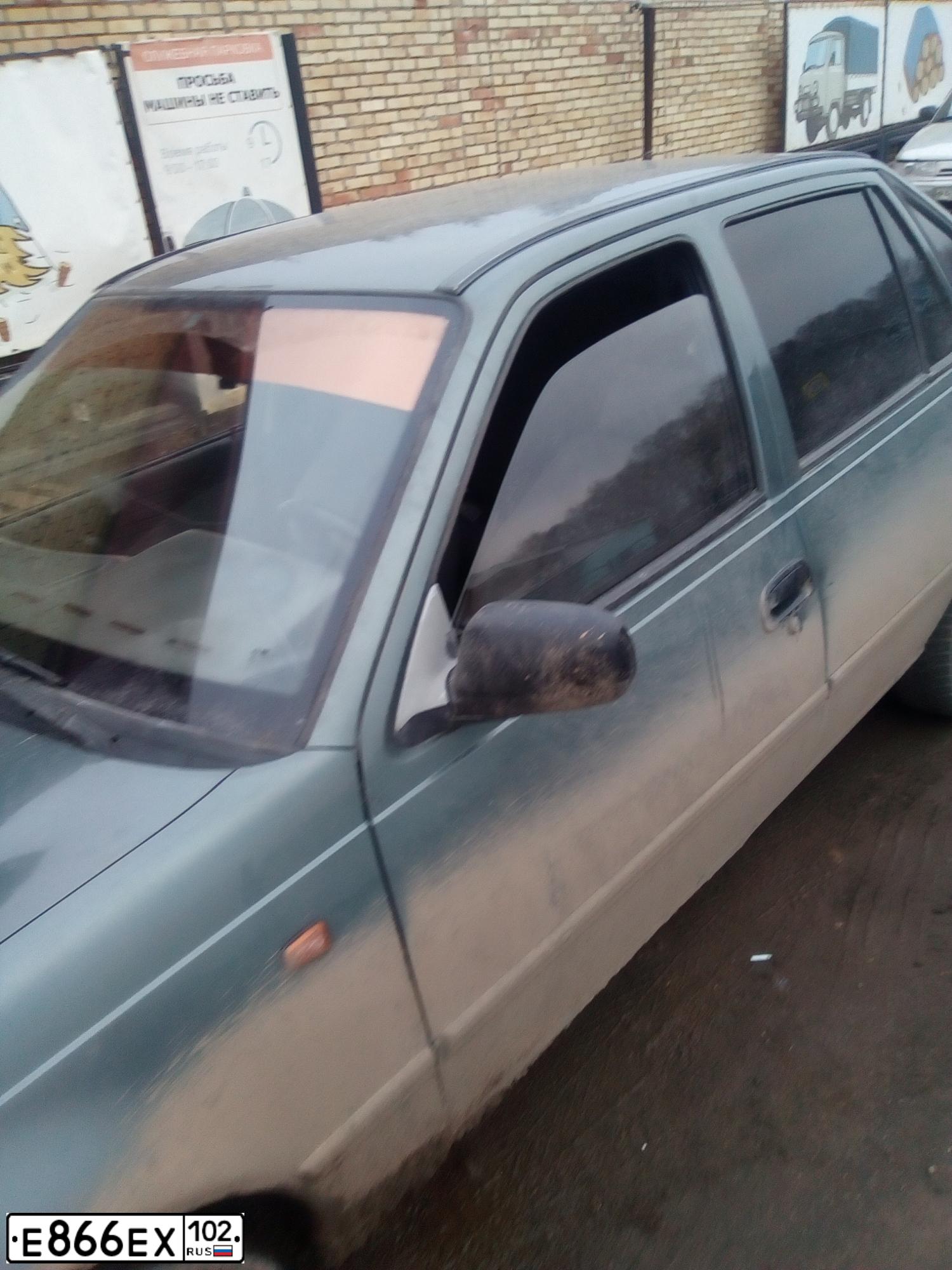 Фото автомобиля DAEWOO NEXIA, 2004 — госномер Е463РХ702. Цвет: СЕРО-ЗЕЛЕНЫЙ