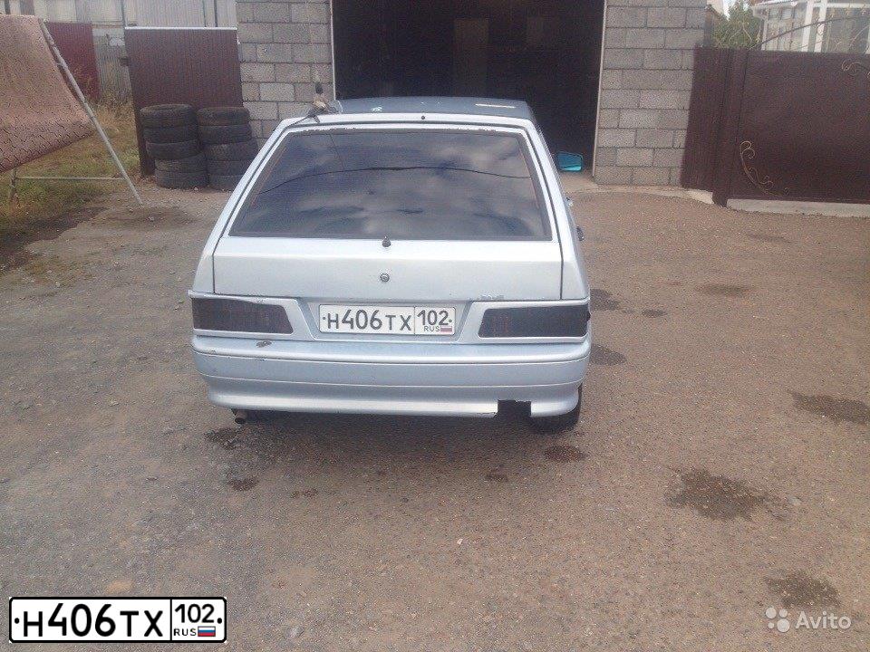 Фото автомобиля LADA 2114 SAMARA, 2007 — госномер Е141ВА102. Цвет: Серебристо-желто-голубой