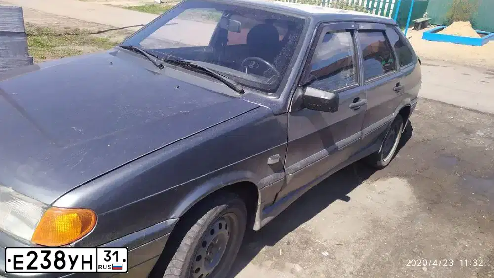 Фото автомобиля LADA 2114 SAMARA, 2006 — госномер Е238УН31. Цвет: СРЕДНИЙ СЕРО-ЗЕЛЕН МЕТ