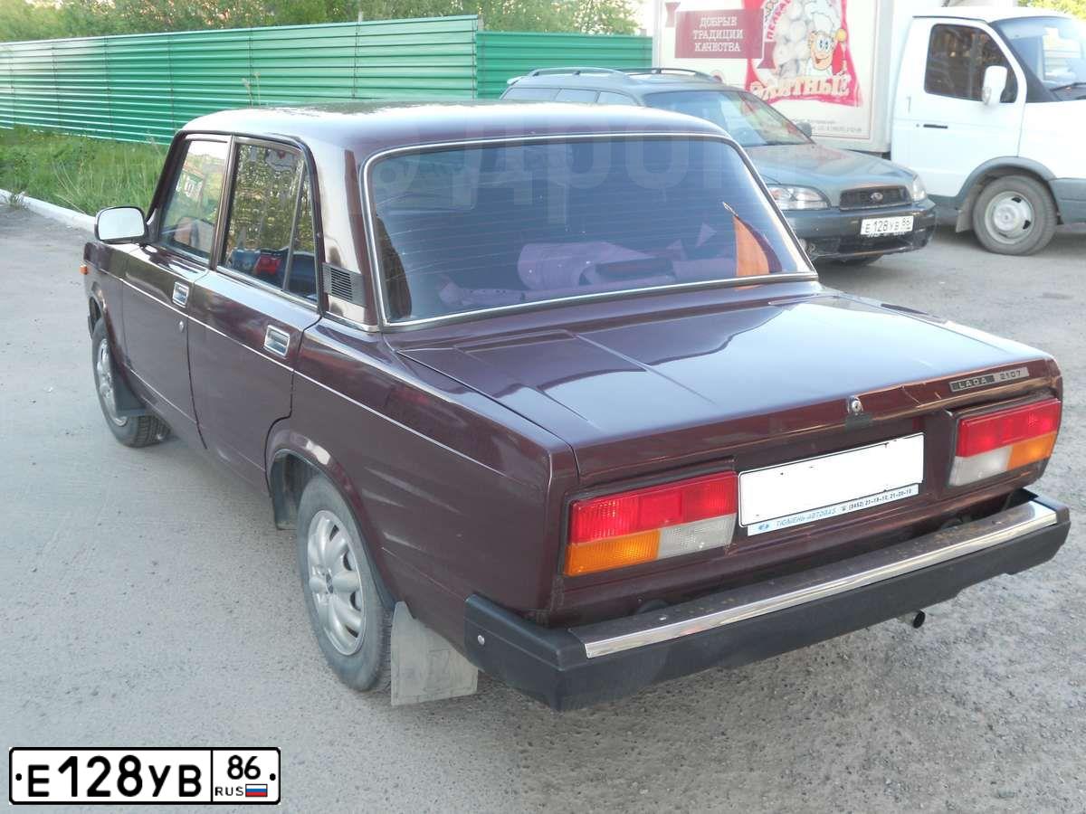 Фото автомобиля SUBARU OUTBACK, 2003 — госномер Е128УВ86. Цвет: СЕРО-ЗЕЛЕНЫЙ