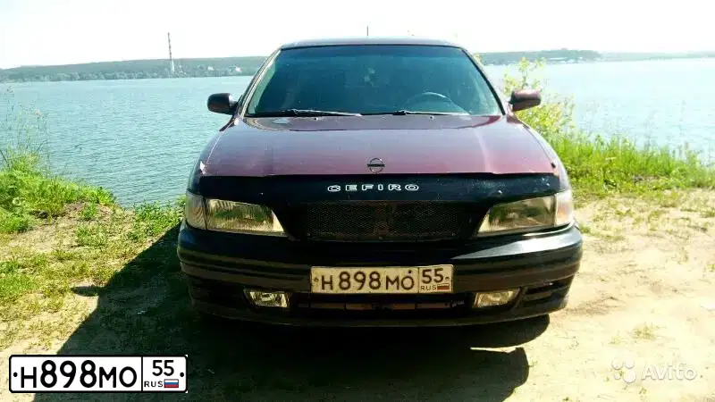 Фото автомобиля NISSAN MAXIMA, 1996 — госномер Н898МО55. Цвет: КРАСНЫЙ