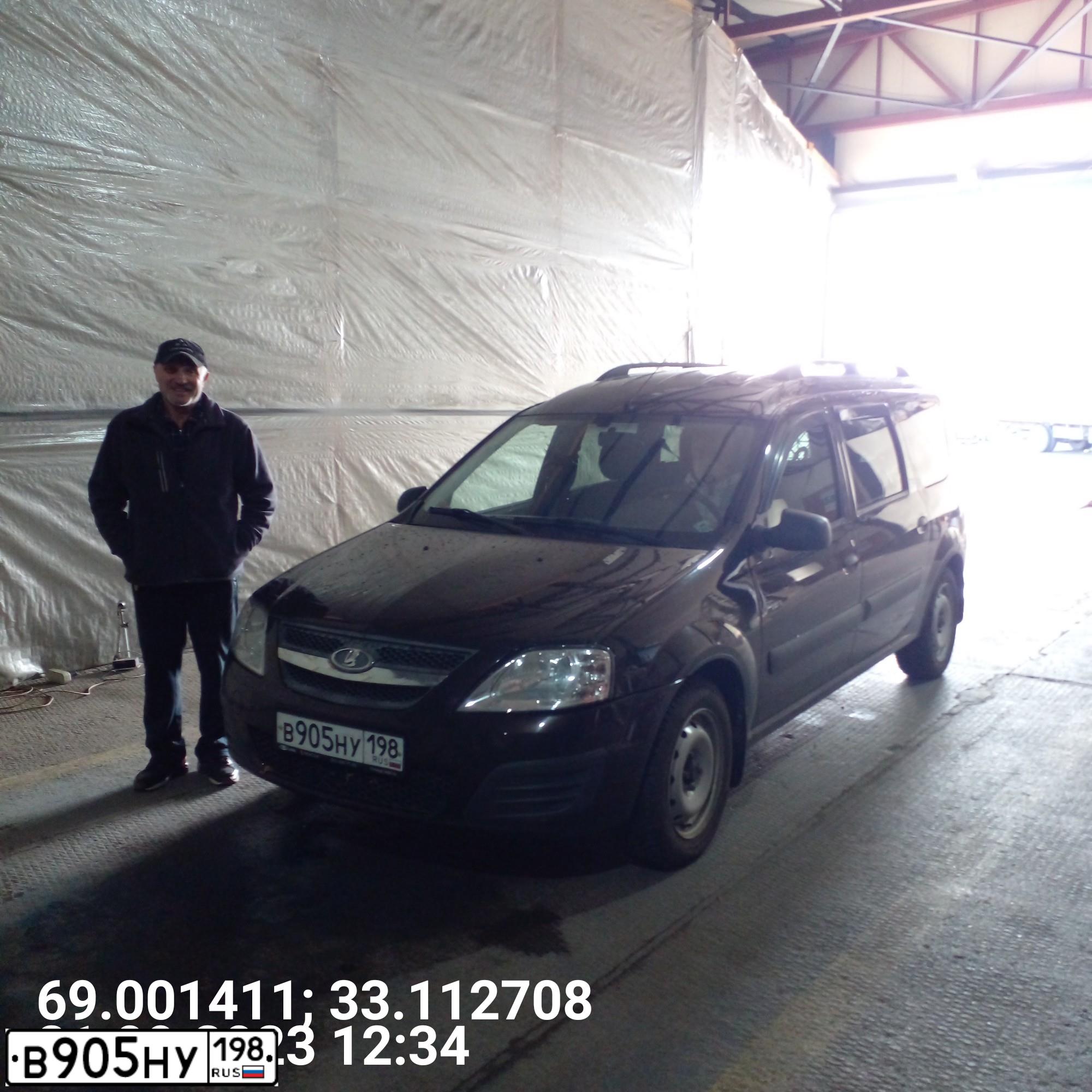 Фото автомобиля LADA LARGUS, 2019 — госномер Е201ОА51. Цвет: ТЕМНО-КОРИЧНЕВЫЙ