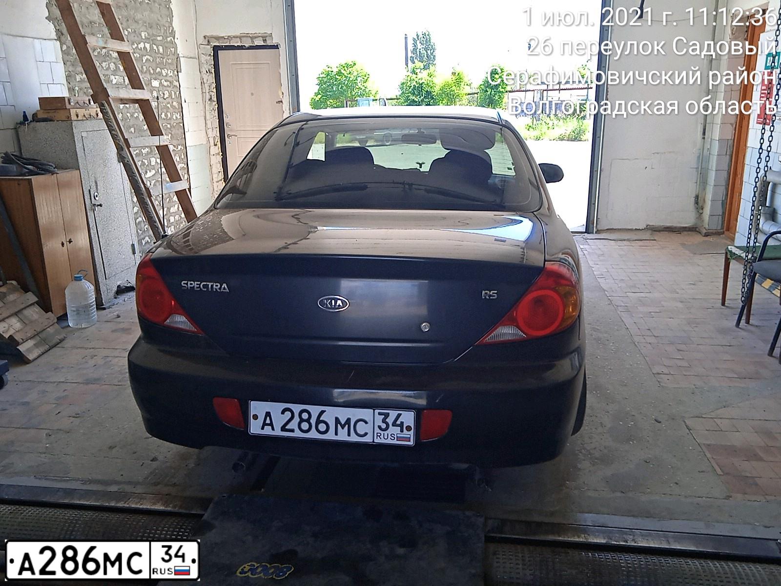 Фото автомобиля KIA SPECTRA, 2009 — госномер А286МС34. Цвет: ЧЕРНЫЙ ЖЕМЧУГ