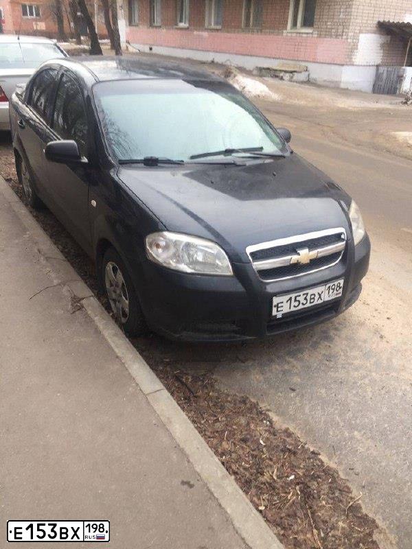 Фото автомобиля CHEVROLET AVEO, 2007 — госномер Е153ВХ198. Цвет: ЧЕРНЫЙ