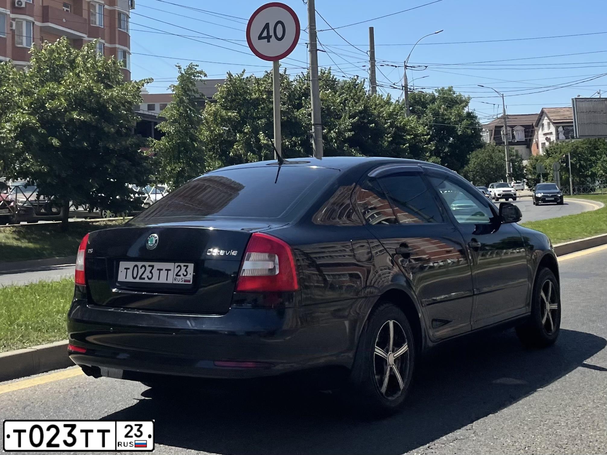 Фото автомобиля SKODA OCTAVIA, 2011 — госномер Т023ТТ23. Цвет: ЧЕРНЫЙ
