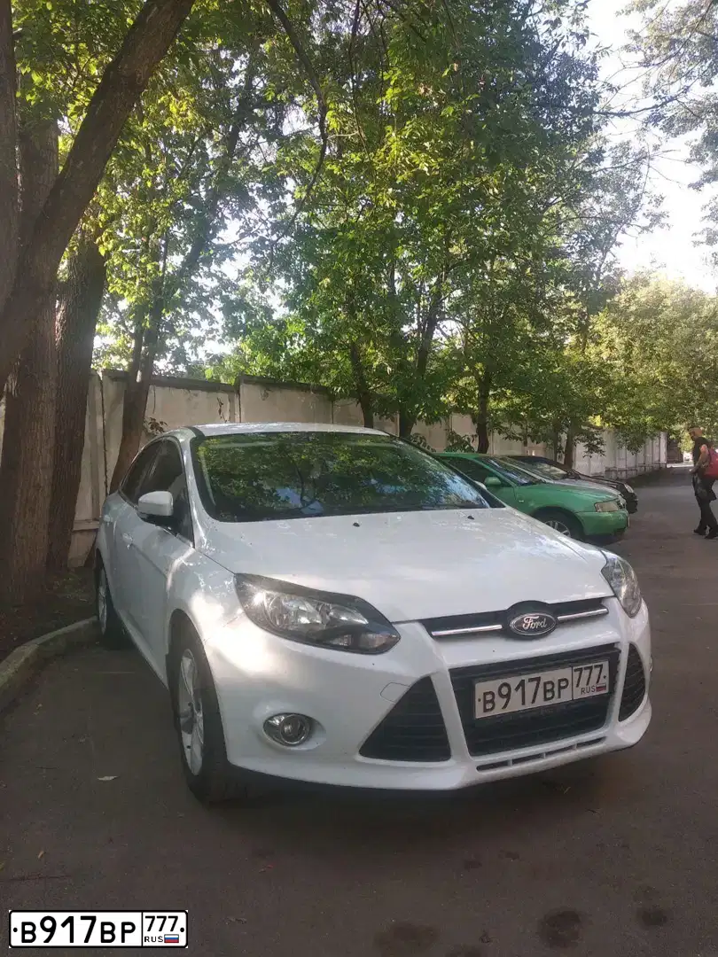 Фото автомобиля FORD FOCUS, 2013 — госномер Т116АМ250. Цвет: Белый