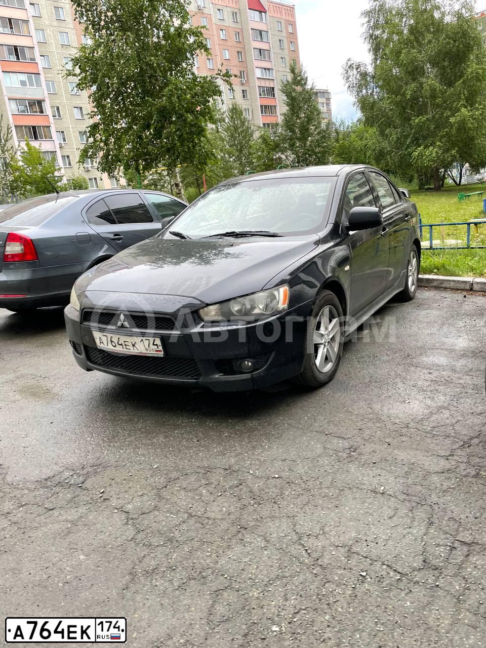 Фото автомобиля MITSUBISHI LANCER, 2008 — госномер А764ЕК174. Цвет: ЧЕРНЫЙ