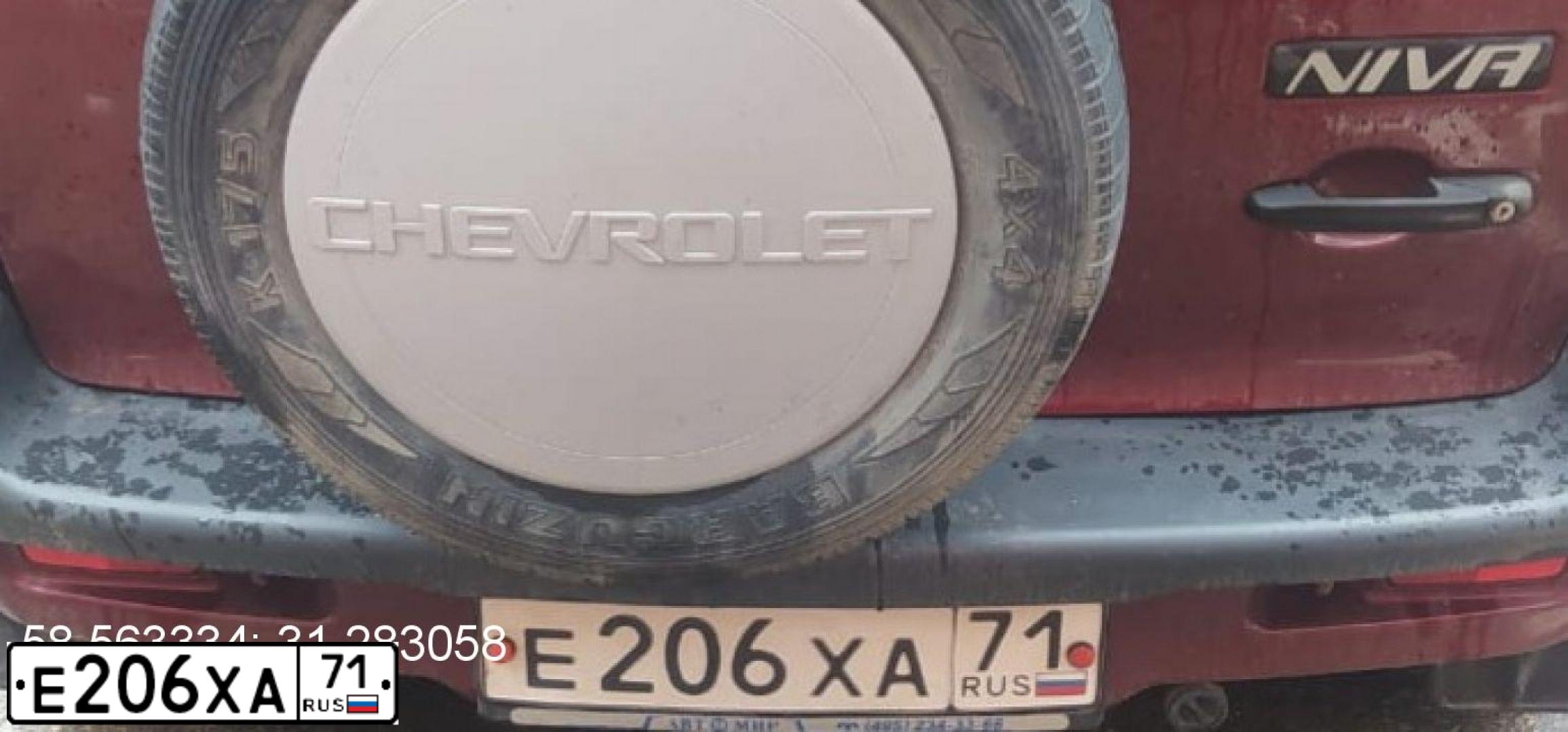 Фото автомобиля CHEVROLET NIVA, 2004 — госномер Р384ТА69. Цвет: СЕРЕБРИСТЫЙ ЯРКО-КРАСНЫЙ