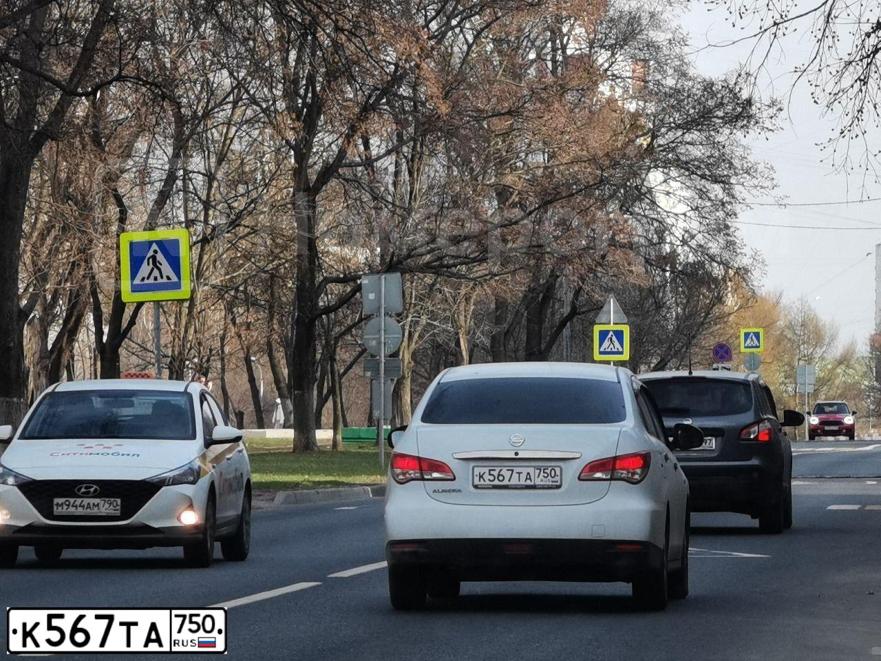 Фото автомобиля VOLKSWAGEN TIGUAN, 2018 — госномер К567ТА750. Цвет: Коричневый